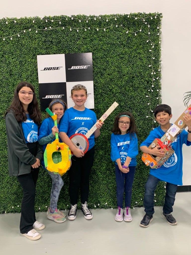 group of RBTV members holding paper guitars